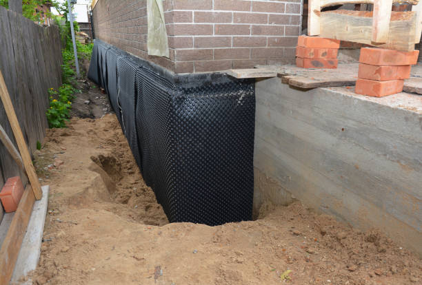 Happy homeowners after waterproofing job in Demotte